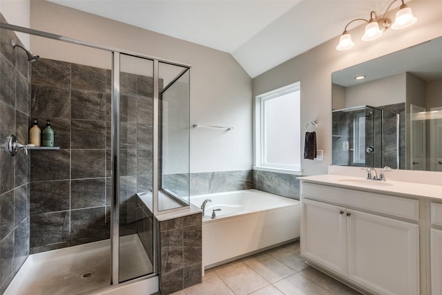 bathroom with lofted ceiling, vanity, separate shower and tub, and tile patterned flooring