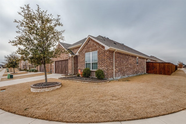 view of side of home with a garage