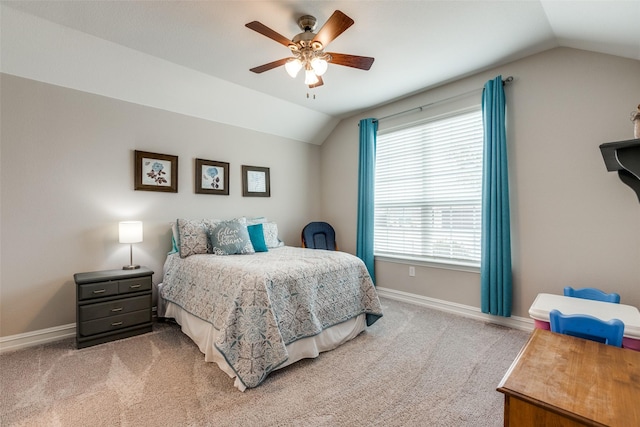 carpeted bedroom featuring lofted ceiling and ceiling fan