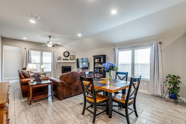 dining space with vaulted ceiling and ceiling fan