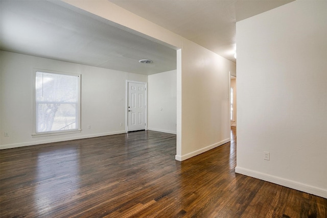 unfurnished room with dark hardwood / wood-style floors