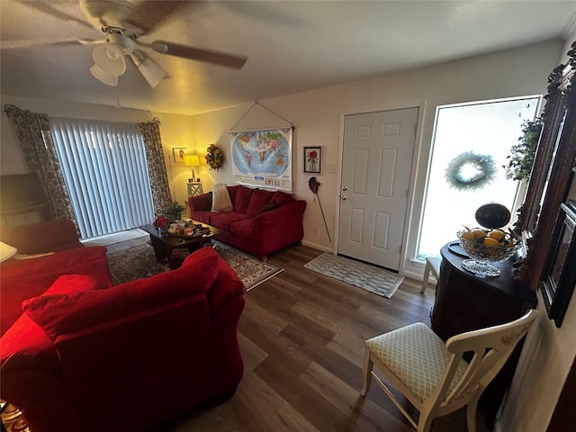 living room featuring dark hardwood / wood-style flooring and ceiling fan