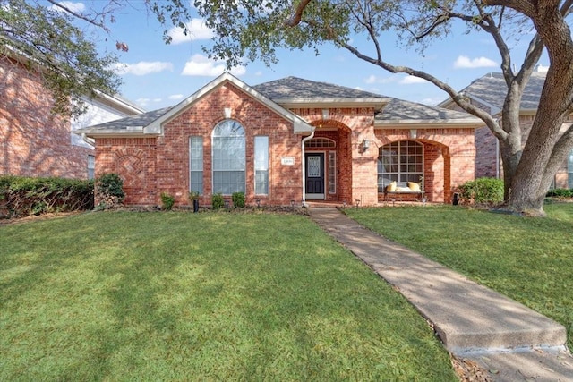 ranch-style house featuring a front lawn