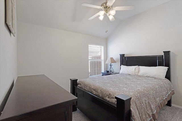 carpeted bedroom featuring lofted ceiling and ceiling fan