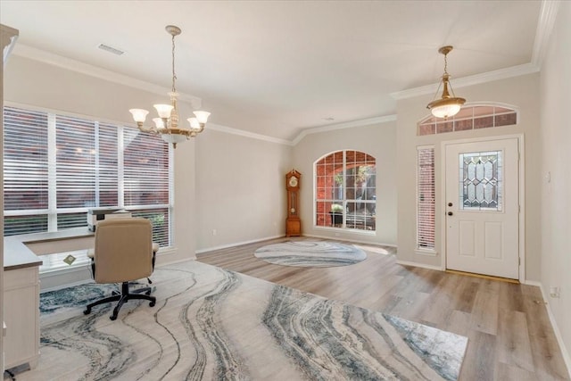 office area with an inviting chandelier, light hardwood / wood-style flooring, and ornamental molding