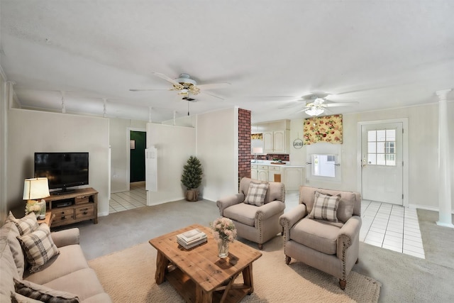 living room featuring ceiling fan and light tile patterned floors