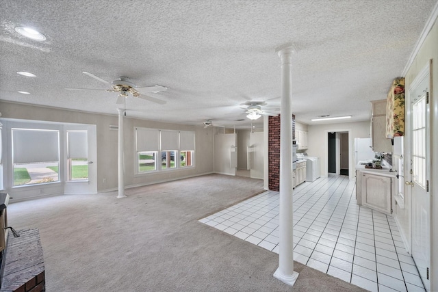 living room featuring decorative columns, light carpet, a textured ceiling, and ceiling fan