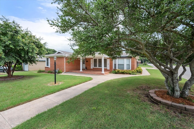 ranch-style home with a front yard