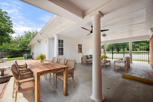 view of patio with an outdoor living space and ceiling fan