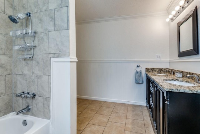 bathroom featuring vanity, tiled shower / bath combo, ornamental molding, and tile patterned floors