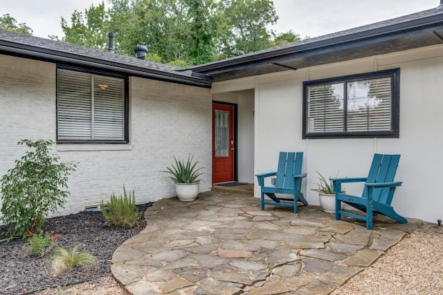 entrance to property with a patio area