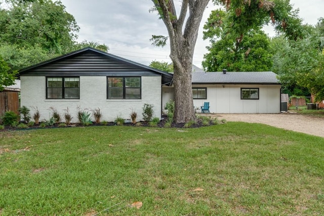 single story home featuring central AC and a front yard