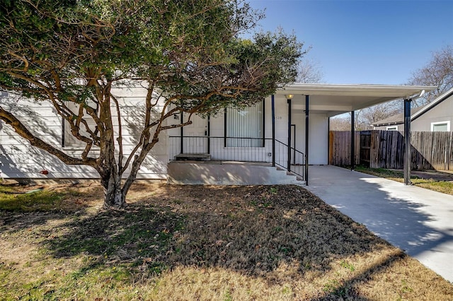 view of front of property featuring a carport