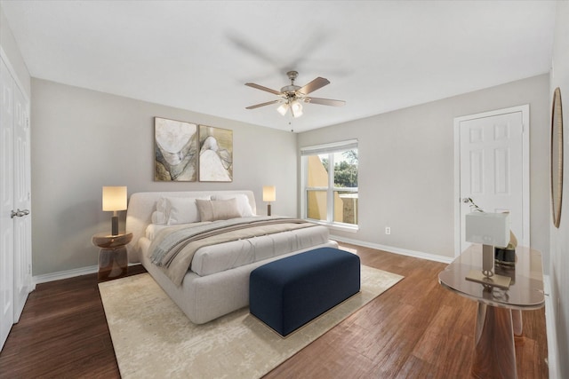 bedroom with ceiling fan and dark hardwood / wood-style floors