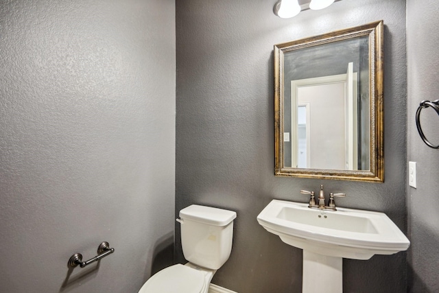 bathroom with sink and toilet