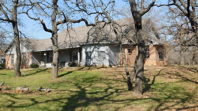 view of home's exterior with a lawn