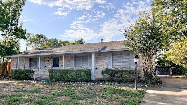 single story home featuring a porch