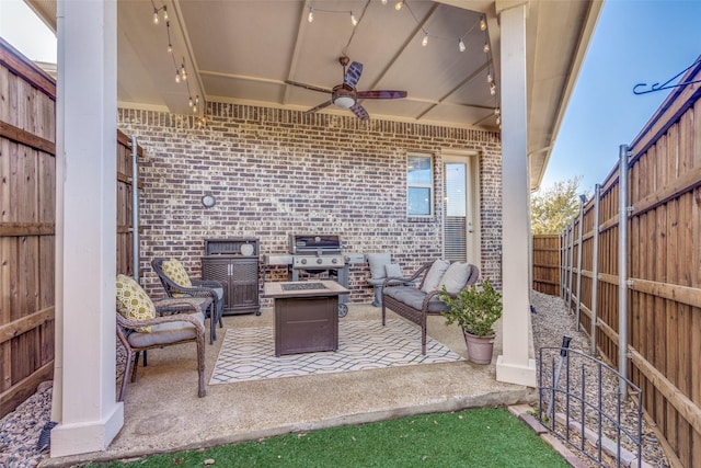 view of patio with a fenced backyard, a ceiling fan, an outdoor hangout area, and grilling area