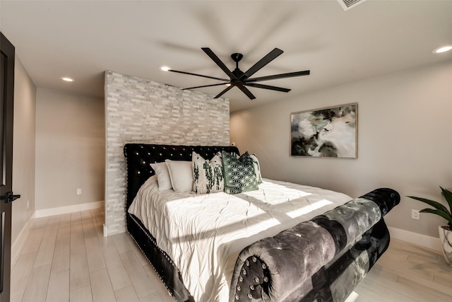 bedroom with ceiling fan and light wood-type flooring