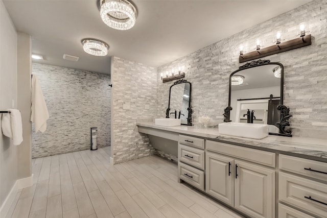 bathroom featuring vanity and hardwood / wood-style floors