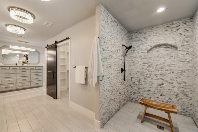 bathroom with a tile shower