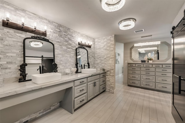 bathroom with vanity and wood-type flooring