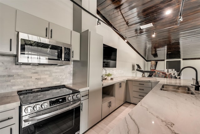 kitchen featuring appliances with stainless steel finishes, sink, decorative backsplash, light stone countertops, and wooden ceiling