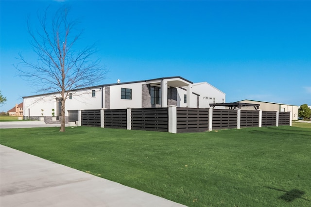 view of side of home with a yard