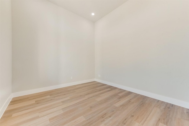 unfurnished room with light wood-type flooring