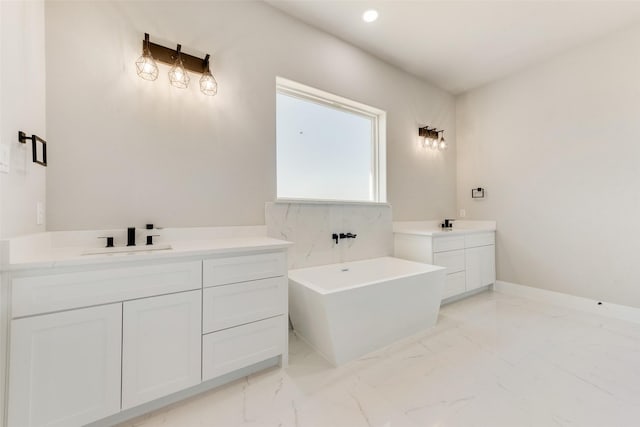 bathroom featuring vanity and a tub to relax in