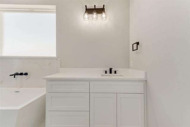 bathroom featuring vanity and a bathtub