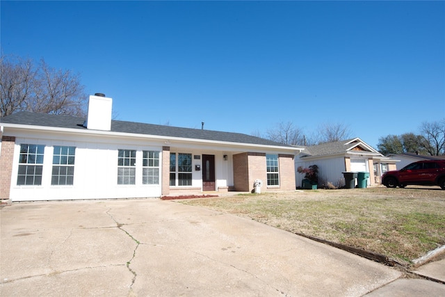 ranch-style home with a front lawn