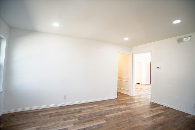 unfurnished room featuring dark hardwood / wood-style flooring