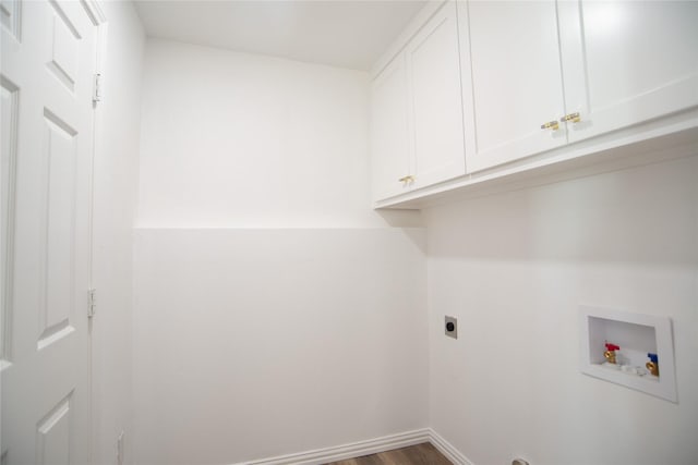 laundry room featuring hardwood / wood-style flooring, cabinets, washer hookup, and electric dryer hookup