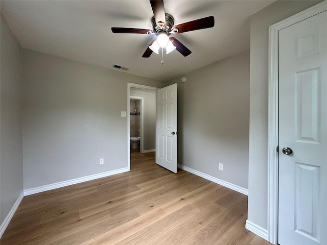 unfurnished bedroom with ceiling fan and light wood-type flooring