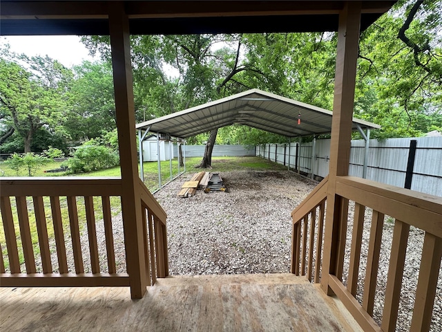 deck featuring a carport