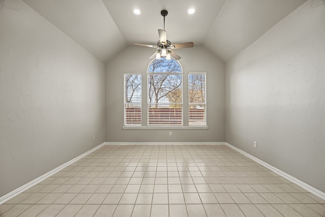 empty room featuring vaulted ceiling and ceiling fan