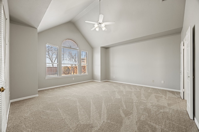 unfurnished bedroom with vaulted ceiling, light colored carpet, and ceiling fan