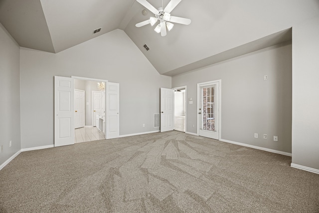 unfurnished bedroom with ceiling fan, connected bathroom, light colored carpet, and high vaulted ceiling