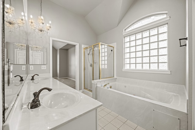 bathroom with tile patterned flooring, vanity, independent shower and bath, and vaulted ceiling