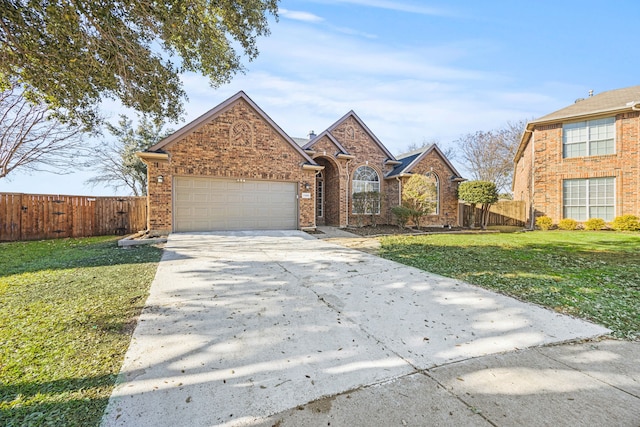 front facade featuring a garage and a front yard