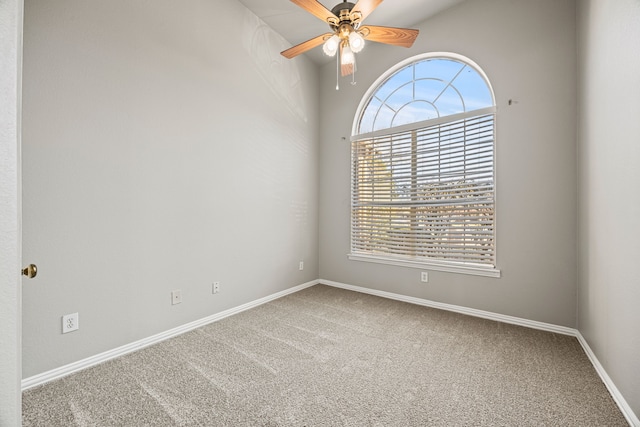 carpeted empty room with ceiling fan