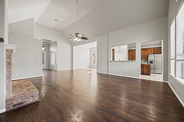 unfurnished living room with high vaulted ceiling, ceiling fan, and light hardwood / wood-style floors