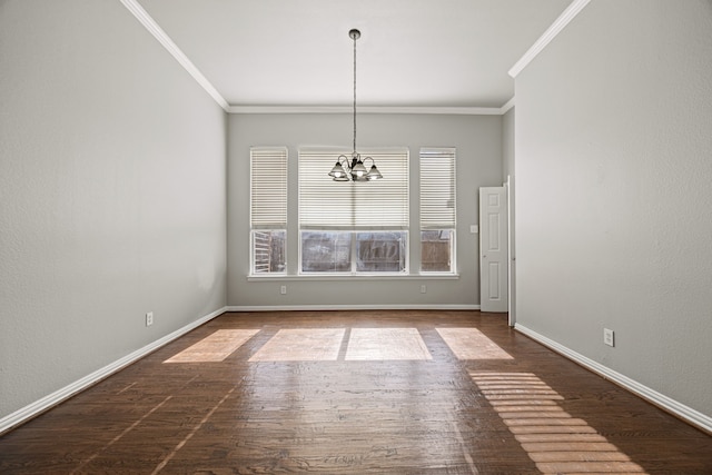 unfurnished dining area featuring dark wood-type flooring, ornamental molding, and a notable chandelier