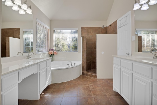 bathroom featuring lofted ceiling, an inviting chandelier, vanity, tile patterned floors, and shower with separate bathtub