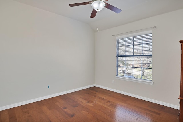 empty room with ceiling fan, lofted ceiling, and hardwood / wood-style floors