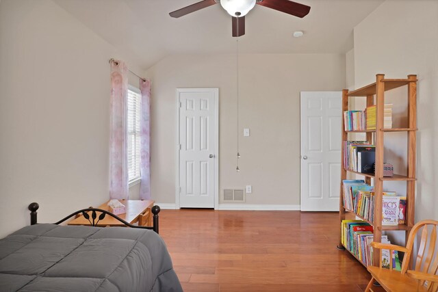 washroom featuring cabinets, washing machine and dryer, a wall mounted AC, and light tile patterned floors