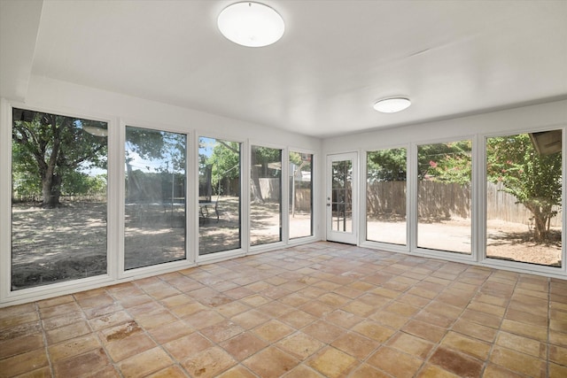 unfurnished sunroom with a healthy amount of sunlight