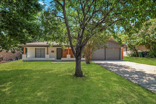 single story home featuring a garage and a front yard