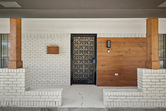 doorway to property with a porch